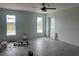 Finished bedroom space with tile floors, large windows, and a door to the outside at 13541 Jeronimo Ln, Port Charlotte, FL 33981