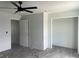 Bedroom with a ceiling fan, wood-look tile flooring, and closet at 13541 Jeronimo Ln, Port Charlotte, FL 33981