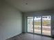 Open living space with sliding glass doors leading to the backyard at 13541 Jeronimo Ln, Port Charlotte, FL 33981