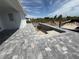 New construction home featuring concrete pool under construction and stone pavers at 13541 Jeronimo Ln, Port Charlotte, FL 33981