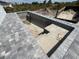 New construction home featuring concrete pool under construction and stone pavers at 13541 Jeronimo Ln, Port Charlotte, FL 33981