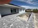 New construction home featuring concrete pool under construction, patio with stone pavers at 13541 Jeronimo Ln, Port Charlotte, FL 33981