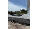 New construction backyard pool features sleek lines, a tanning ledge and a modern brick surround at 13541 Jeronimo Ln, Port Charlotte, FL 33981