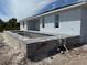 Home features concrete pool under construction, tiled accents, and stone pavers at 13541 Jeronimo Ln, Port Charlotte, FL 33981