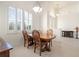 Dining room with wood table and chairs, near entryway at 15258 Addax Ave, Port Charlotte, FL 33981