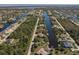 Aerial view of the property, showing the location along a canal in a beautiful waterfront community at 15600 Aldama Cir, Port Charlotte, FL 33981