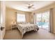 Bedroom with pool view and sliding glass doors at 15600 Aldama Cir, Port Charlotte, FL 33981