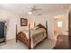 Well-lit bedroom with a queen-size bed and private bathroom access at 15600 Aldama Cir, Port Charlotte, FL 33981