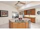 Spacious kitchen island featuring granite countertops, a stainless steel dishwasher, and ample storage space at 15600 Aldama Cir, Port Charlotte, FL 33981