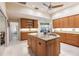 Bright kitchen with a large center island, granite countertops, and plenty of cabinet storage at 15600 Aldama Cir, Port Charlotte, FL 33981