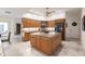Open kitchen boasting granite countertops, stainless steel appliances, and a large island at 15600 Aldama Cir, Port Charlotte, FL 33981