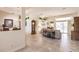 Bright living room with tiled floors, comfortable seating, and view of pool at 15600 Aldama Cir, Port Charlotte, FL 33981