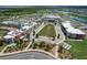 Aerial view of a school campus with athletic fields and buildings at 15976 Shoreline Dr, Punta Gorda, FL 33982