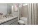 Bathroom featuring granite countertop, shower, and tub with neutral paint color at 16114 Highgate St, Port Charlotte, FL 33953