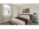 Modern bedroom featuring neutral tones and a cozy, minimalist design at 16114 Highgate St, Port Charlotte, FL 33953