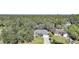 High-angle view of a home in a quiet, wooded neighborhood at 17080 Kellog Ave, Port Charlotte, FL 33954