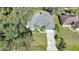 Aerial view of house, driveway and surrounding neighborhood at 17080 Kellog Ave, Port Charlotte, FL 33954