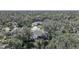 An aerial view of a home surrounded by lush trees and vegetation at 17080 Kellog Ave, Port Charlotte, FL 33954