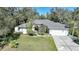 An aerial shot of a house with a gray roof and a white garage door at 17080 Kellog Ave, Port Charlotte, FL 33954