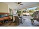 Relaxing patio with seating area and view to backyard at 17080 Kellog Ave, Port Charlotte, FL 33954