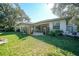 Large backyard with patio, landscaping, and wooden fence at 17080 Kellog Ave, Port Charlotte, FL 33954