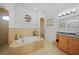 Elegant bathroom with a large soaking tub and a separate shower at 17080 Kellog Ave, Port Charlotte, FL 33954