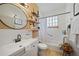 Clean bathroom with a bathtub, toilet, and updated vanity at 17080 Kellog Ave, Port Charlotte, FL 33954