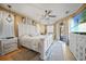 Spacious main bedroom with a large bed, dresser, and access to a private patio at 17080 Kellog Ave, Port Charlotte, FL 33954