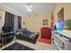 Bright bedroom with a bed, desk, and large TV at 17080 Kellog Ave, Port Charlotte, FL 33954