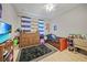 Youth bedroom with a bed, dresser, and TV at 17080 Kellog Ave, Port Charlotte, FL 33954