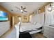 King-size bed, large TV, and access to hallway bathroom at 17080 Kellog Ave, Port Charlotte, FL 33954