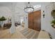 Bright entryway with double doors and a chandelier at 17080 Kellog Ave, Port Charlotte, FL 33954