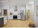 Bright kitchen featuring stainless steel appliances and white cabinets at 17080 Kellog Ave, Port Charlotte, FL 33954