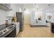 Modern kitchen with stainless steel appliances and white cabinetry at 17080 Kellog Ave, Port Charlotte, FL 33954