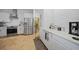 Modern kitchen with stainless steel appliances and white cabinetry at 17080 Kellog Ave, Port Charlotte, FL 33954