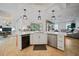 Open concept kitchen with island, stainless steel appliances, and breakfast nook at 17080 Kellog Ave, Port Charlotte, FL 33954