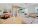 Bright living room with sectional sofa, window seat, and entertainment center at 17080 Kellog Ave, Port Charlotte, FL 33954