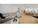 Open living room with sectional sofa and view of kitchen and dining area at 17080 Kellog Ave, Port Charlotte, FL 33954