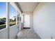 Inviting screened porch with tiled flooring and exterior access at 22266 Catherine Ave, Port Charlotte, FL 33952