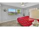 Bedroom with red comforter and water view at 250 Bangsberg Se Rd, Port Charlotte, FL 33952