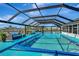 Inviting swimming pool with screened enclosure at 250 Bangsberg Se Rd, Port Charlotte, FL 33952