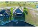 Aerial view of house, landscaping, and canal at 3736 Bal Harbor Blvd, Punta Gorda, FL 33950
