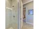 Clean bathroom with a walk-in shower and view of bedroom at 3736 Bal Harbor Blvd, Punta Gorda, FL 33950