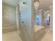 Luxurious bathroom with a large walk-in shower and a soaking tub at 3736 Bal Harbor Blvd, Punta Gorda, FL 33950
