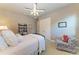 Bright bedroom with a comfy bed, chair, and built-in shelving at 3736 Bal Harbor Blvd, Punta Gorda, FL 33950