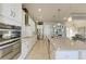 Modern kitchen with white cabinetry, granite countertops, and stainless steel appliances at 3736 Bal Harbor Blvd, Punta Gorda, FL 33950