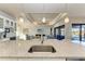 Kitchen with granite island, stainless steel sink, and views of living room at 3736 Bal Harbor Blvd, Punta Gorda, FL 33950