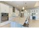 Modern kitchen with white cabinetry, granite countertops, and stainless steel appliances at 3736 Bal Harbor Blvd, Punta Gorda, FL 33950