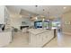 Open concept kitchen with large island and adjacent dining area at 3736 Bal Harbor Blvd, Punta Gorda, FL 33950