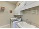 Laundry room with washer, dryer, and cabinets at 3736 Bal Harbor Blvd, Punta Gorda, FL 33950